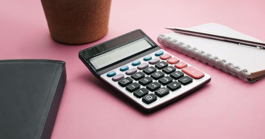 Calculator on pink desk